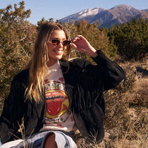 on model - blonde female outdoors wearing dime optics fairfax cat eye sunglasses with a brushed gold frame and sharp brown gradient lenses front view