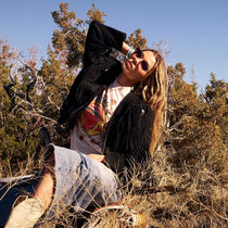 on model - blonde female outdoors wearing dime optics fairfax cat eye sunglasses with a brushed gold frame and sharp brown gradient lenses front view