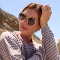on model - female wearing dime optics featuring the alameda square sunglasses with a silver and crystal clear frame and orchid gradient lenses front view