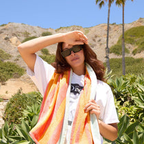 on model - female at the beach wearing les do makeup x dime optics girls night sunglasses with a glossy black frame and grey polarized lenses front view