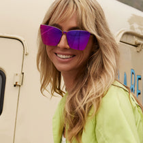 on model - female wearing dime optics glendale cat eye sunglasses with a black frame and candy pink mirror lenses front view
