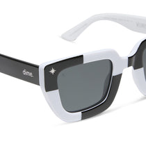 wednesday x dime optics featuring the wednesday addams square sunglasses with a black and white frame with grey polarized lenses detailed view