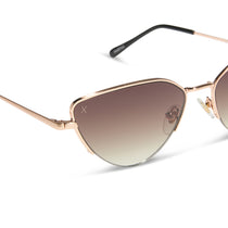 dime optics fairfax cat eye sunglasses with a brushed gold frame and sharp brown gradient lenses detailed view