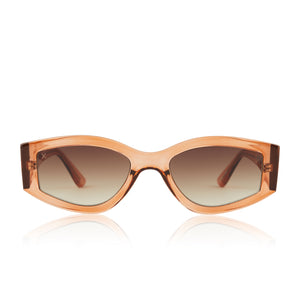 dime optics robertson round sunglasses with a translucent apricot acetate frame and a brown gradient sharp lenses front view